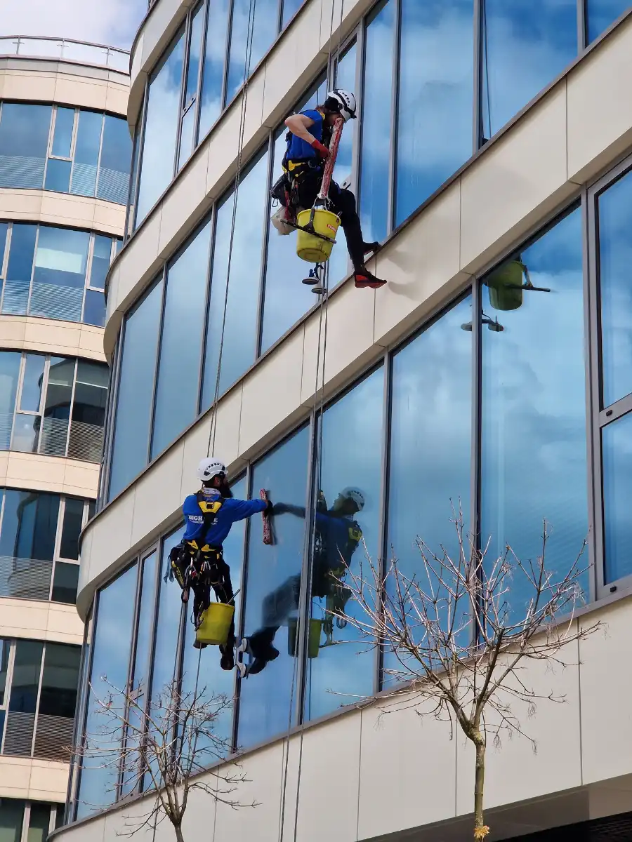 Professional commercial window cleaning on a Huntsville, AL office building exterior