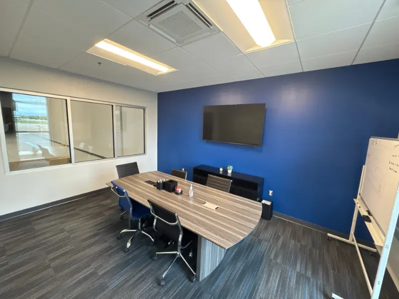 Continuous daytime vacuuming and maintenance of a carpeted conference room in Huntsville