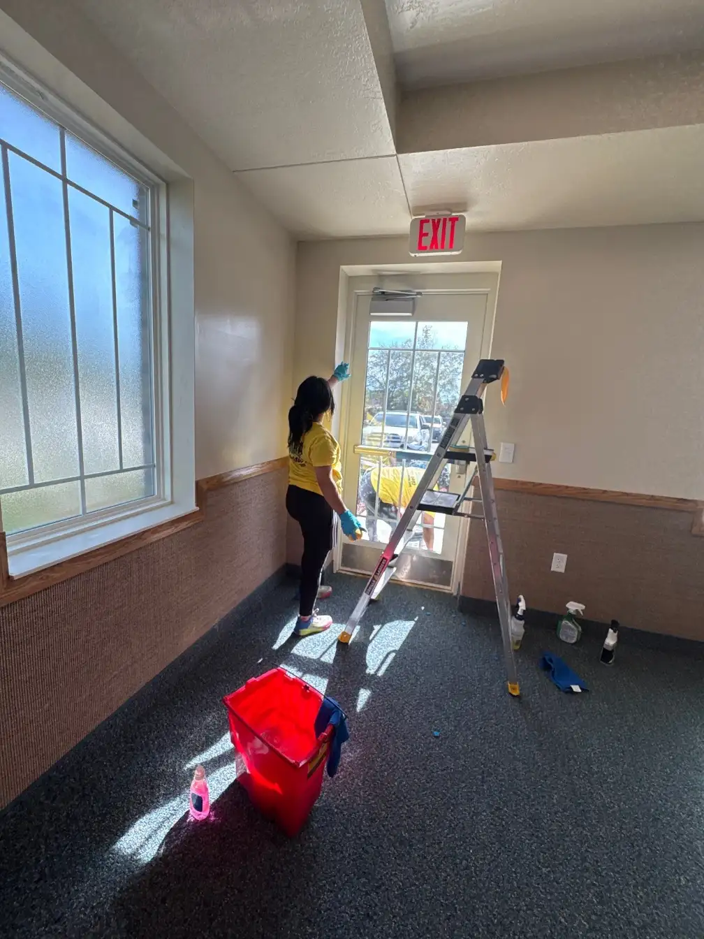 Glass entry and exit door cleaning for a Huntsville, AL business