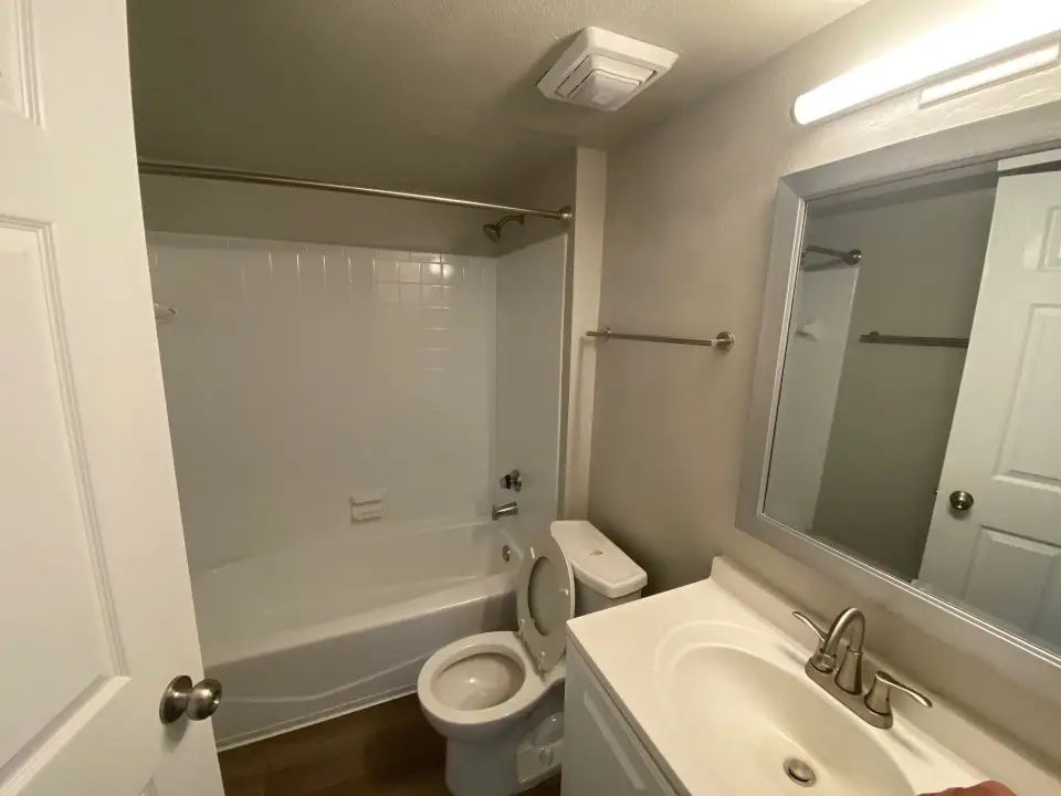 Sanitized apartment bathroom and tub for property management turnover