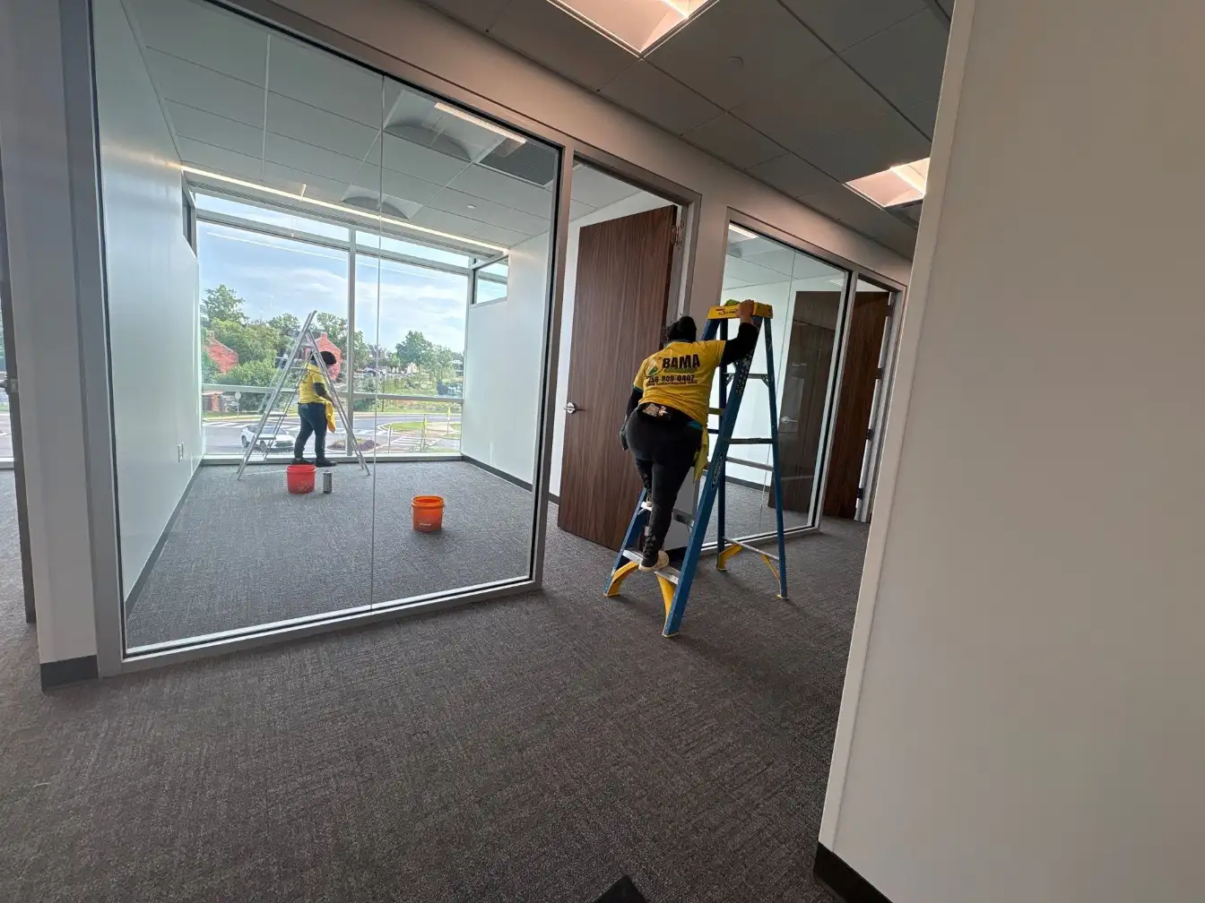 Streak-free interior glass walls after commercial window cleaning in a Huntsville, AL office