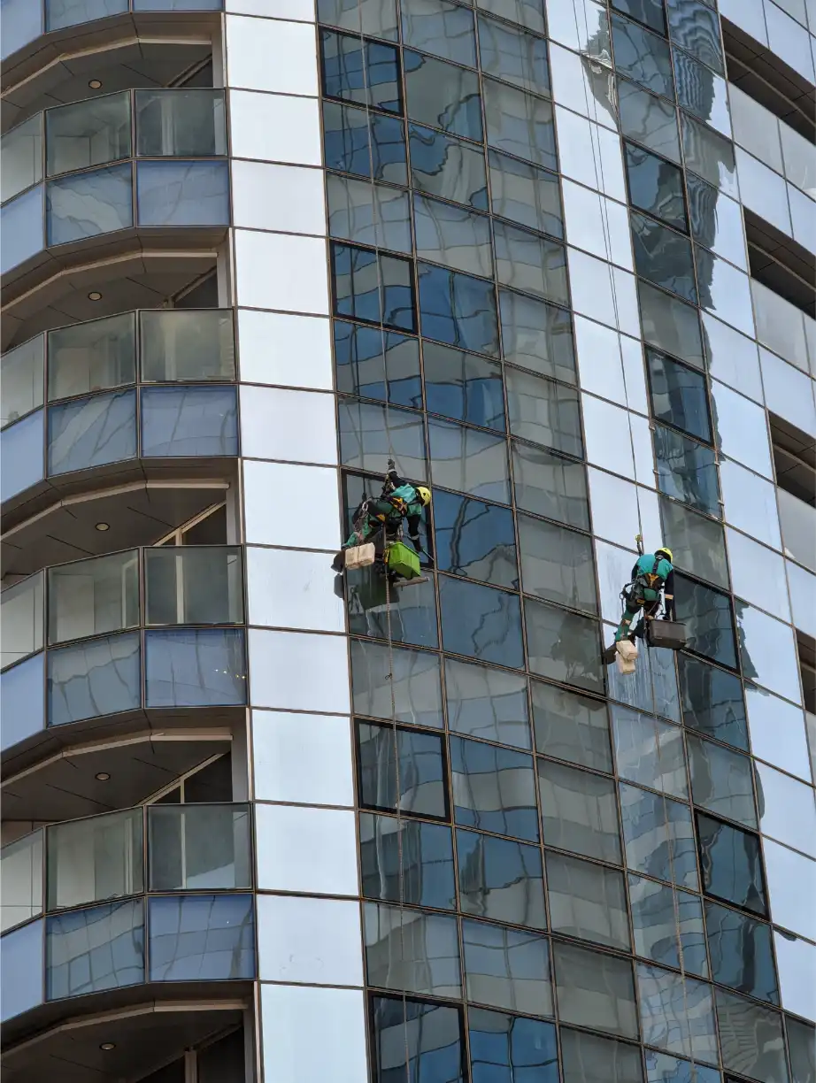 Exterior high-rise commercial window cleaning on a multi-story building in Huntsville, AL
