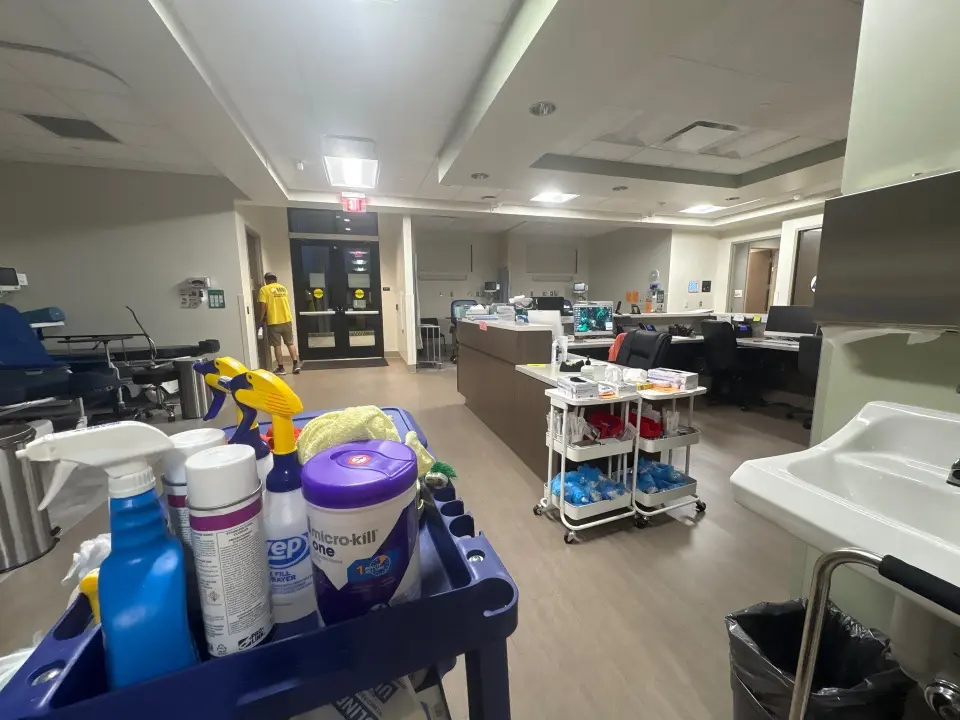 Professional day porter maintaining cleanliness and hygiene in a Huntsville medical facility