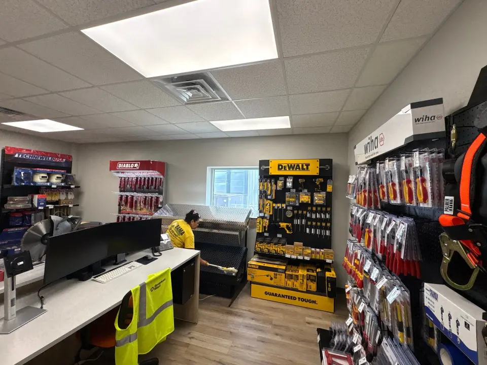 Day porter providing retail store janitorial maintenance during business hours in Huntsville, AL