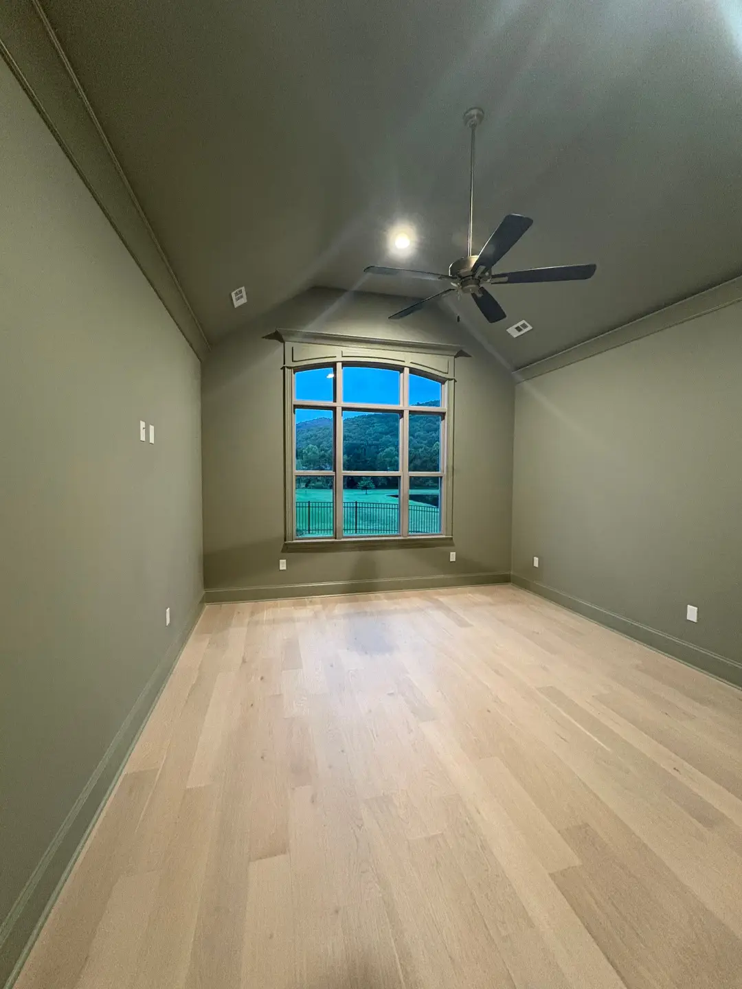 Freshly mopped wood floors in a vacant apartment unit in Rocket City