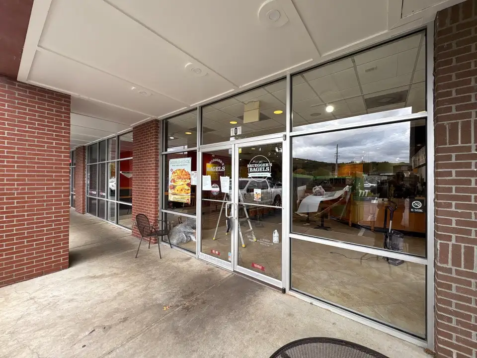 Cleaned exterior glass storefront of a Huntsville, AL bagel restaurant