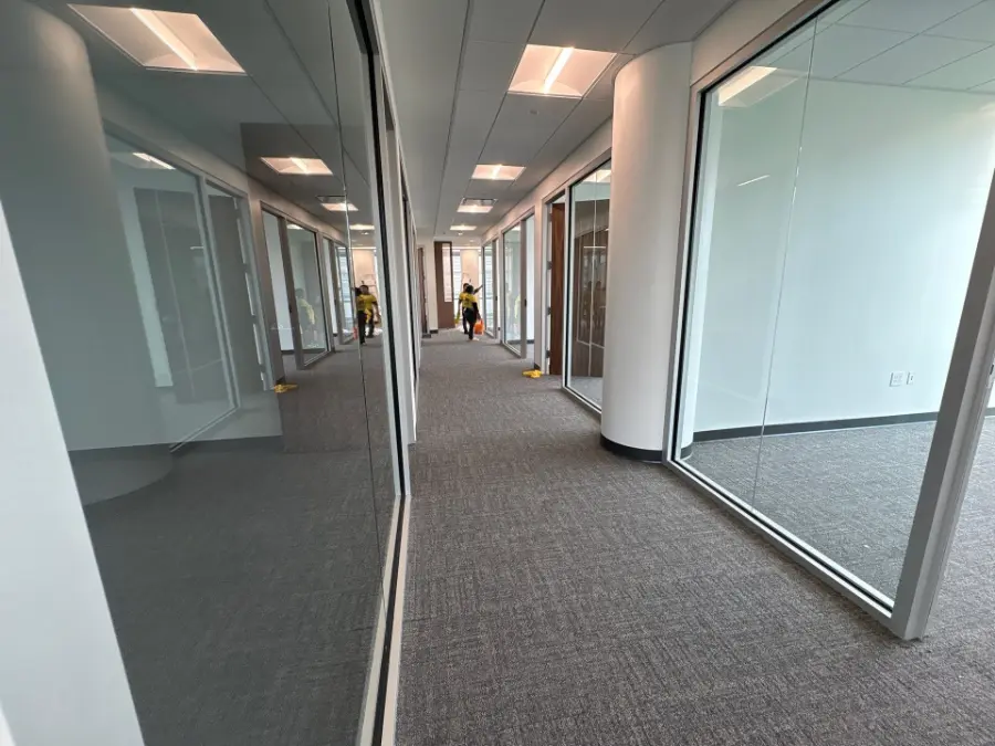 Freshly vacuumed carpeted hallway in a large Huntsville, AL commercial facility