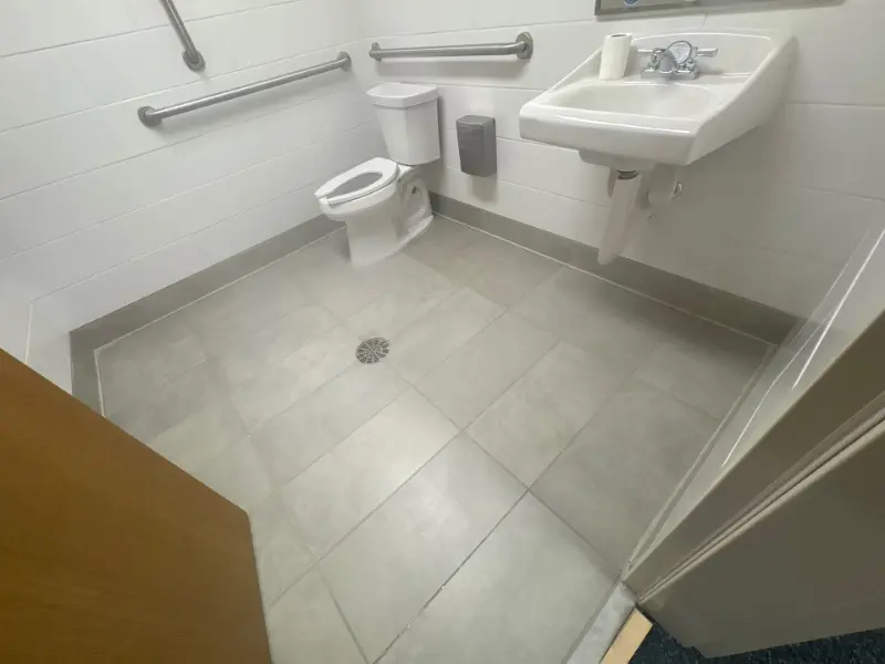 Disinfected accessible hospital restroom floor in a Huntsville, AL medical facility