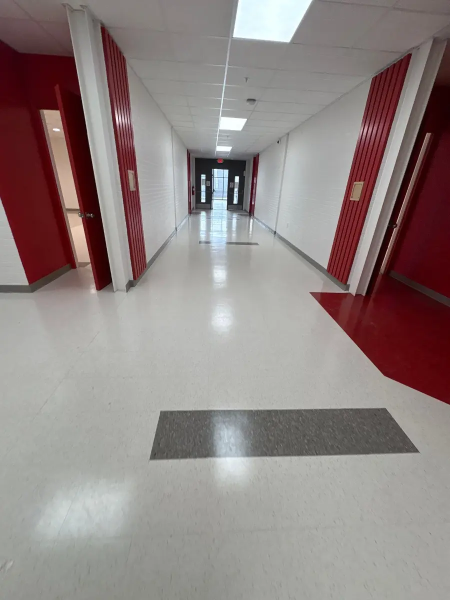 Spotless large hallway in a Huntsville, AL commercial facility after janitorial cleaning