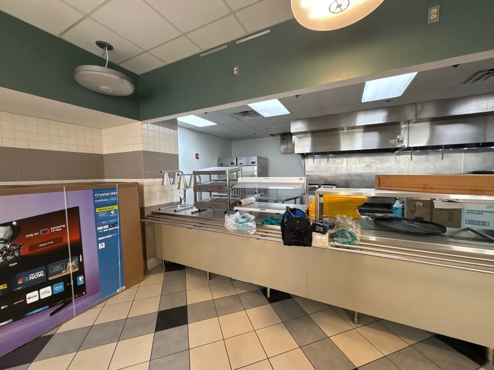Restaurant counter with kitchen behind it cleaned by Mid City Commercial Cleaning in Huntsville, AL