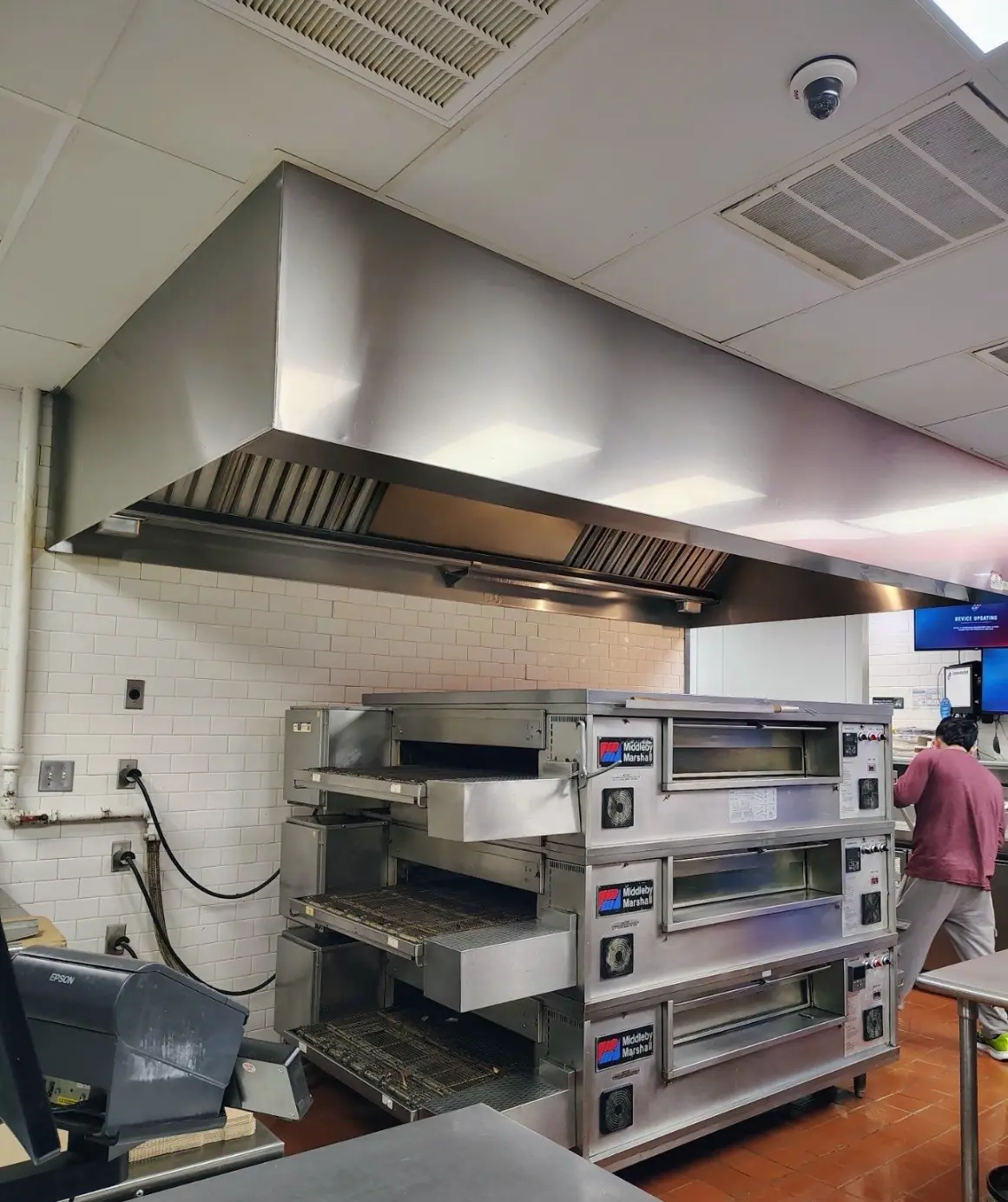 Clean restaurant kitchen exhaust hood serviced by Mid City Commercial Cleaning in Huntsville, AL
