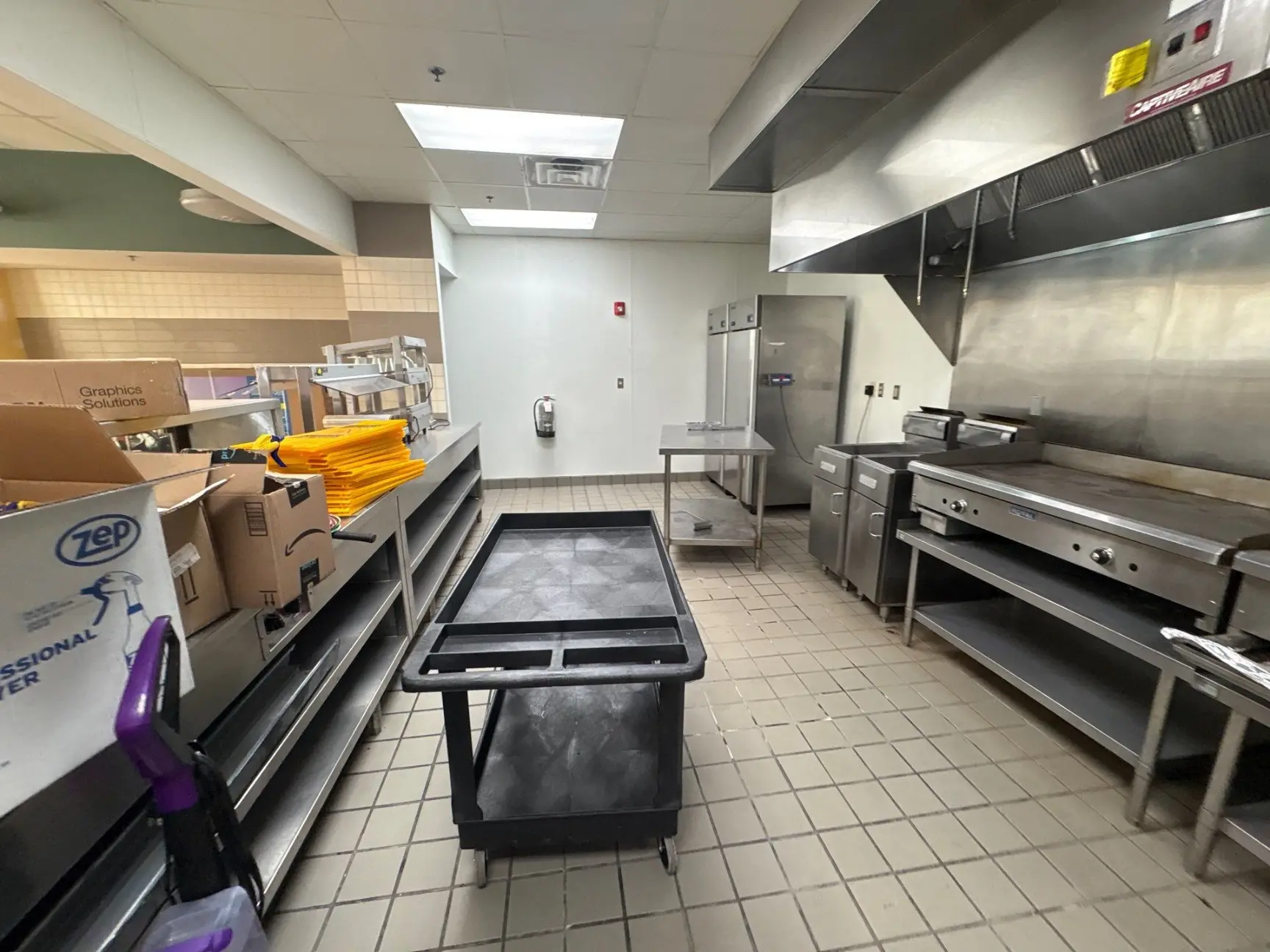 Restaurant kitchen with exhaust hood cleaned by Mid City Commercial Cleaning in Huntsville, AL