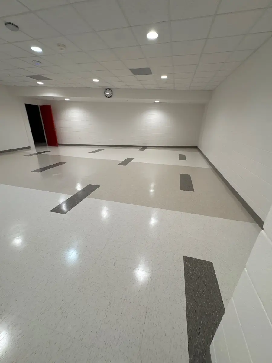 Large tiled function room with freshly cleaned floors, serviced by Mid City Commercial Cleaning in Huntsville, AL