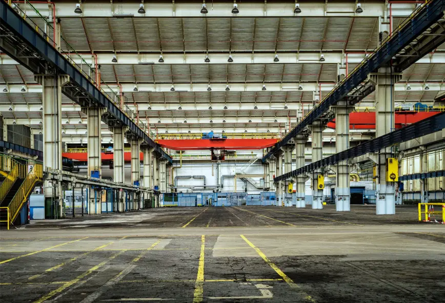 High bay ceiling over a Madison, AL factory warehouse with racking left in place